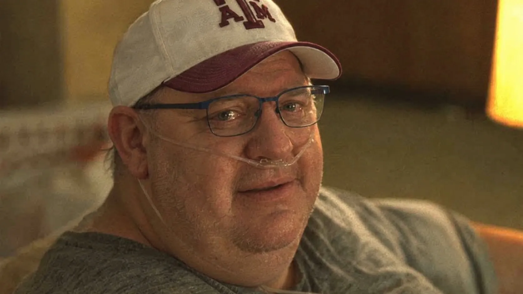 Billy in his Texas A&M cap, smiling
